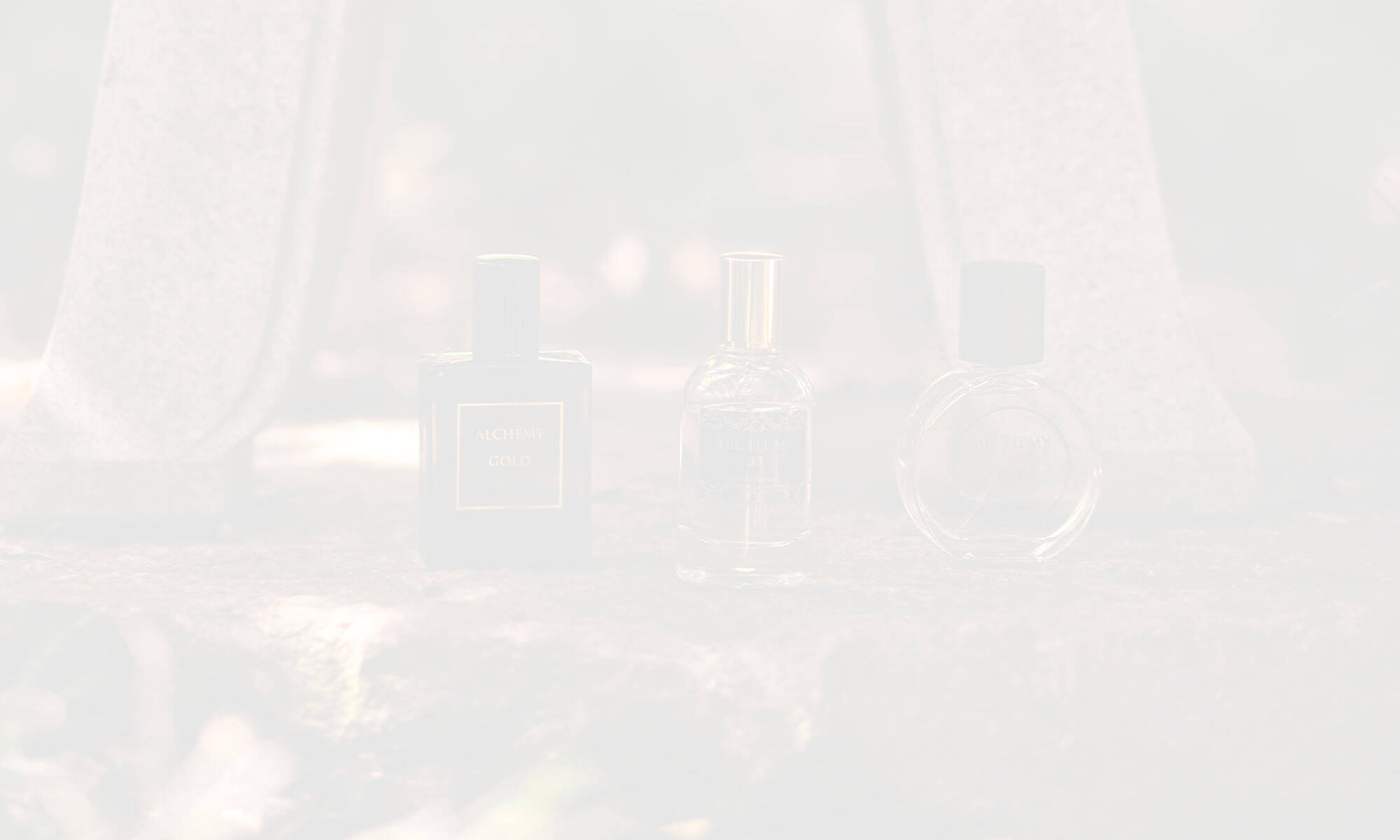 Faded image of 3 Alchemy Perfume products