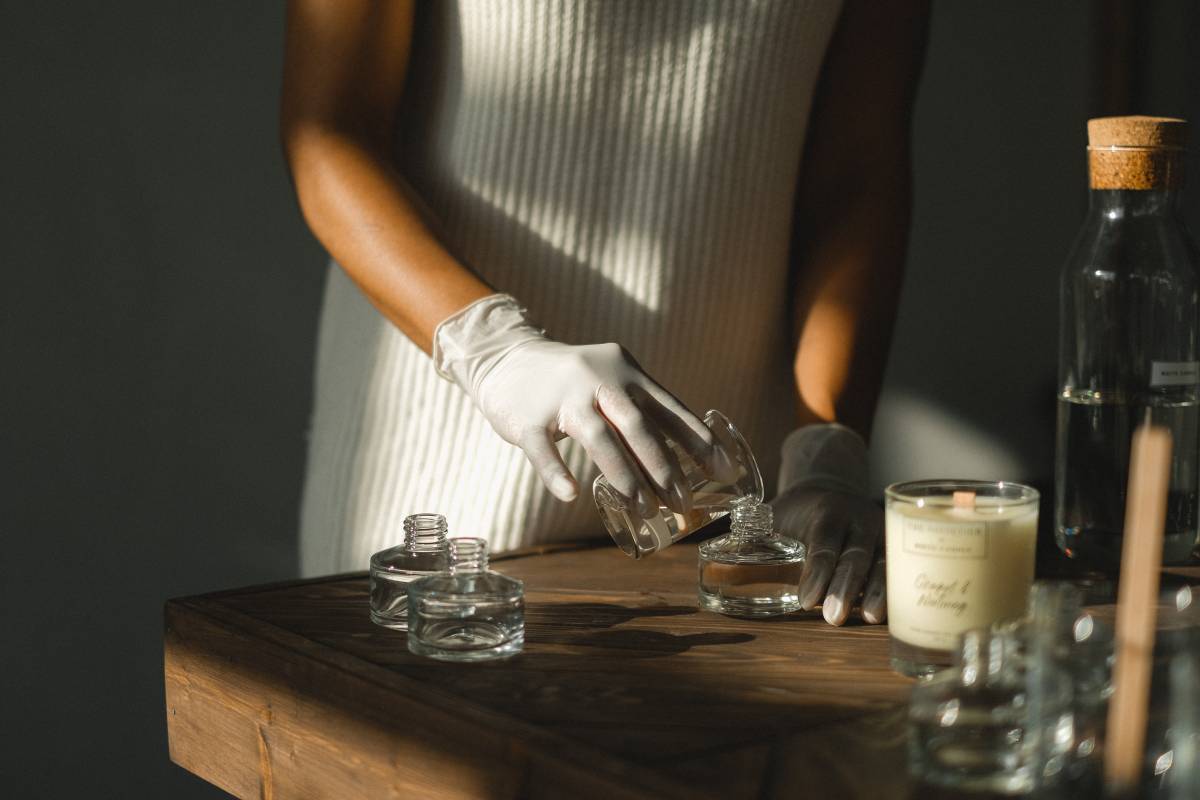 A woman using essential oils to make perfume